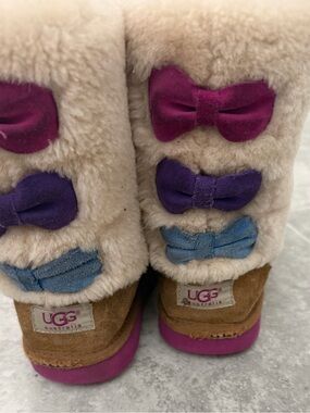 UGG Kids Beige Shearling Boots with Pink, Purple and Blue Bows